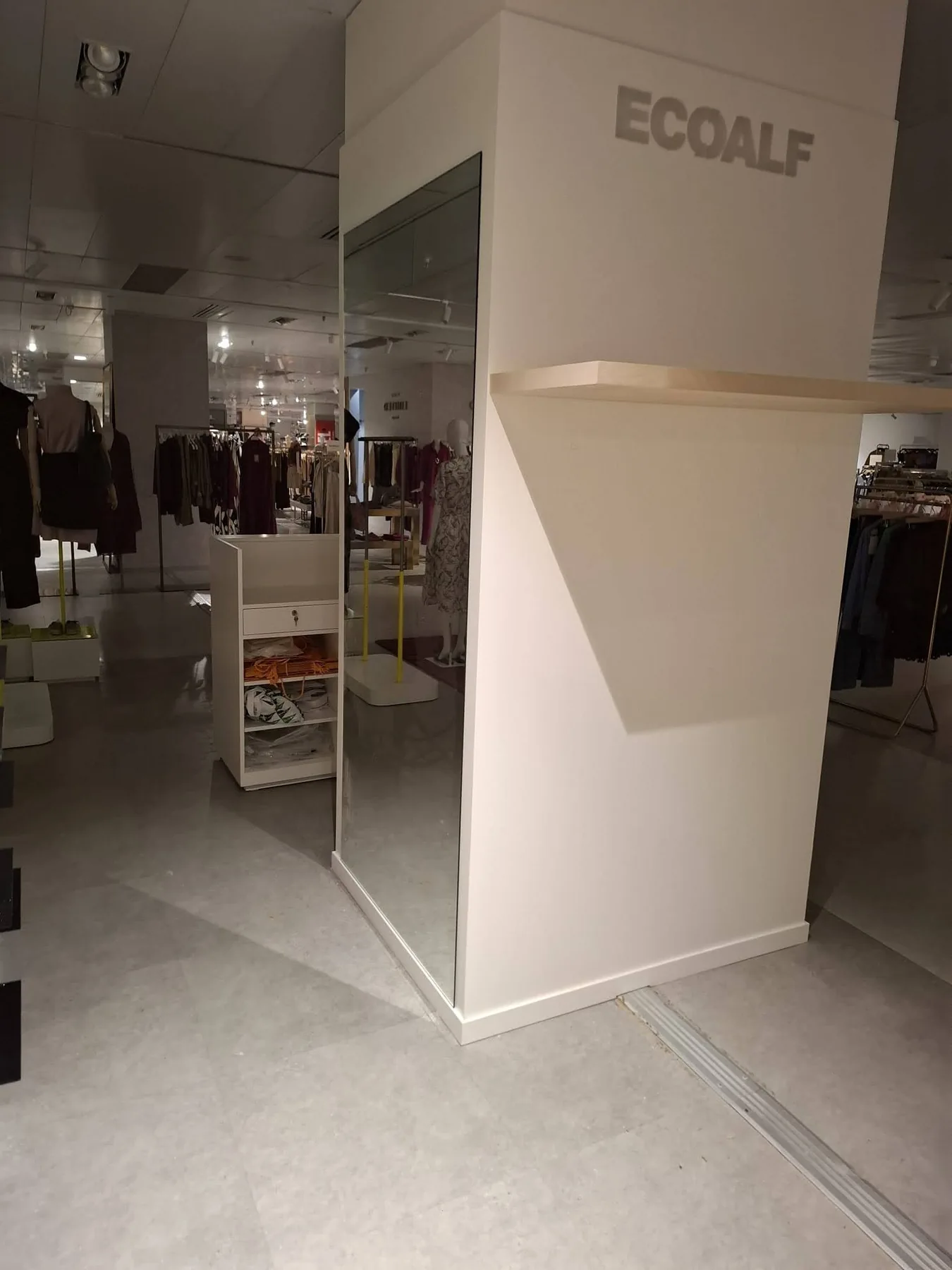 Ecoalf Marbella womenswear branded column with full height mirror