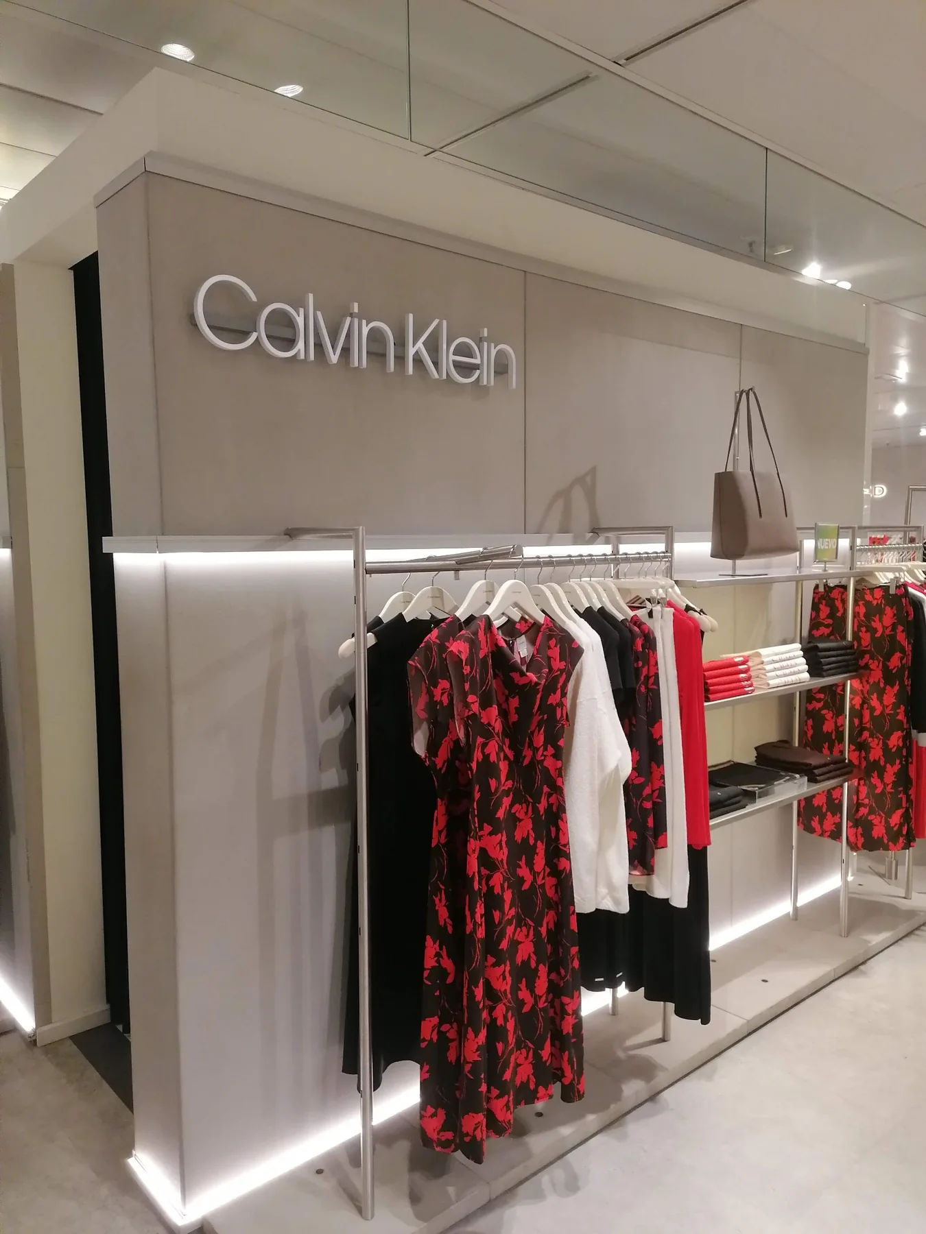 Ecoalf Marbella womenswear existing wall display before intervention