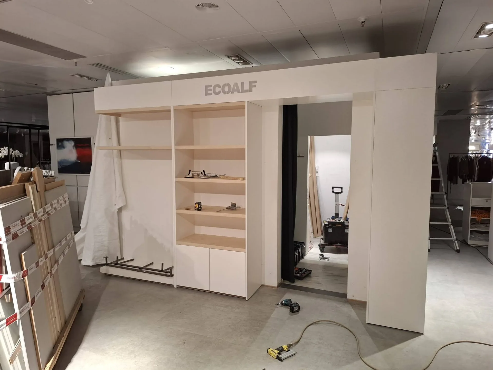 Ecoalf Marbella womenswear front display wall during installation